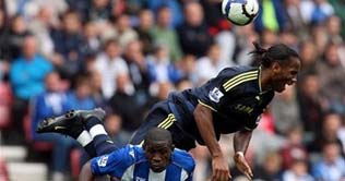 Chelsea slump to Wigan, United on top